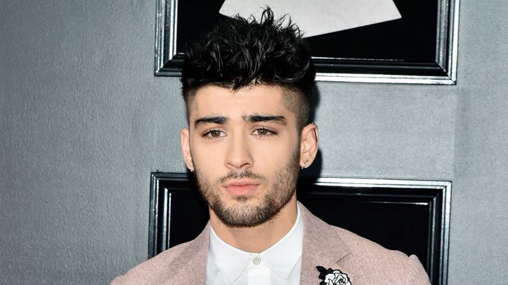 Zayn channels his inner Jedi as he leaves a studio with a lightsaber ...