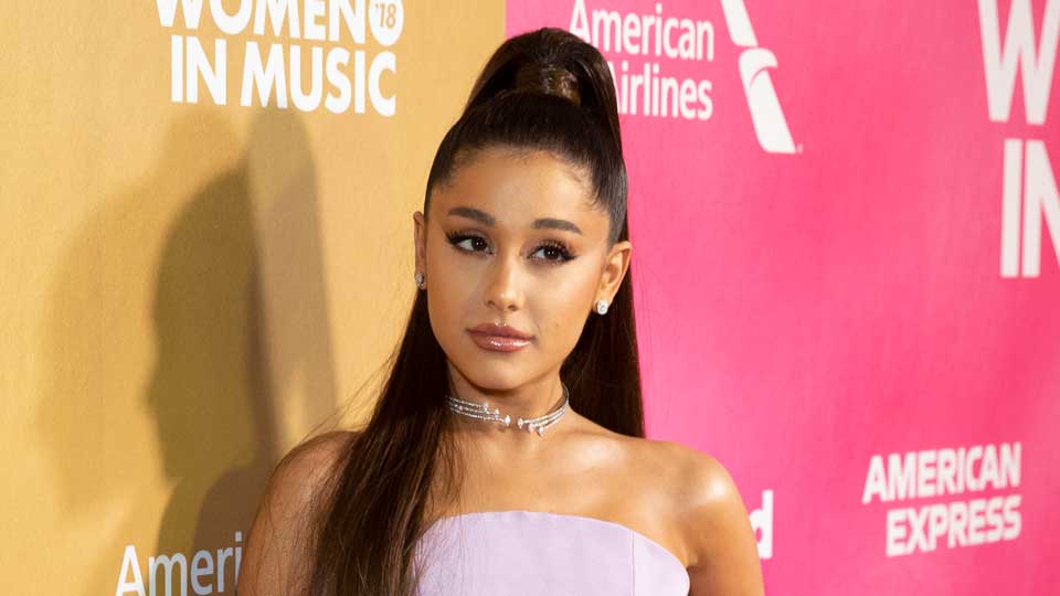 What is Ariana Grandes shoulder tattoo Wedding photo intrigues fans