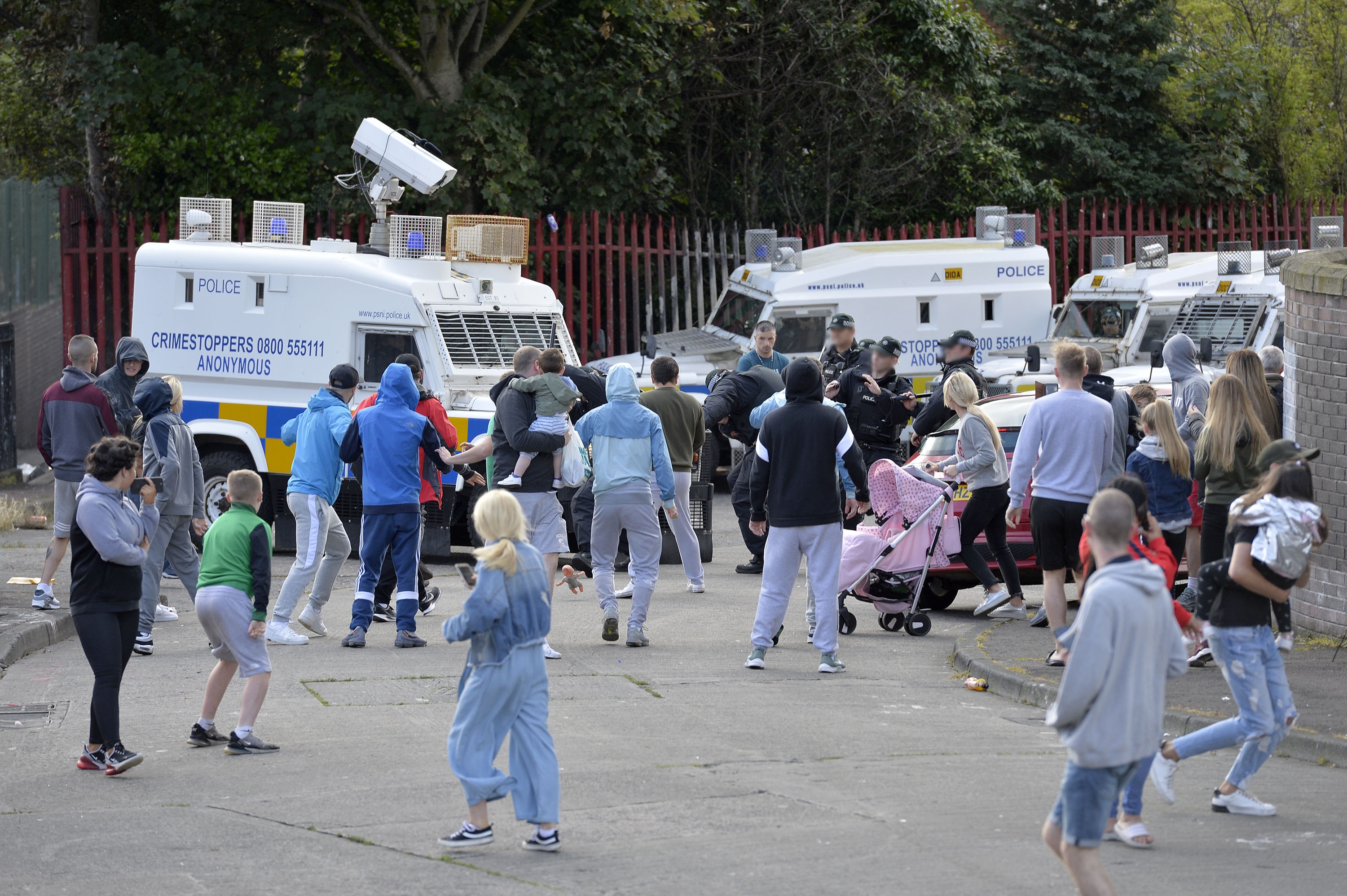PSNI officer knocked to ground during New Lodge bonfire site riot ...