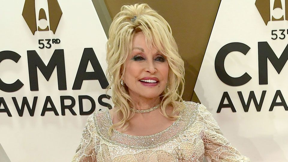 Dolly Parton's Arm Tattoos: The Meaning Behind Them - wide 6