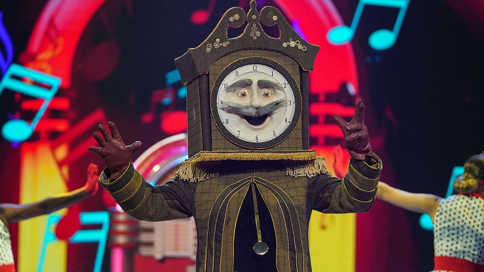 Clock Mask Singer Is Chris Kamara Grandfather Clock on The Masked Singer?