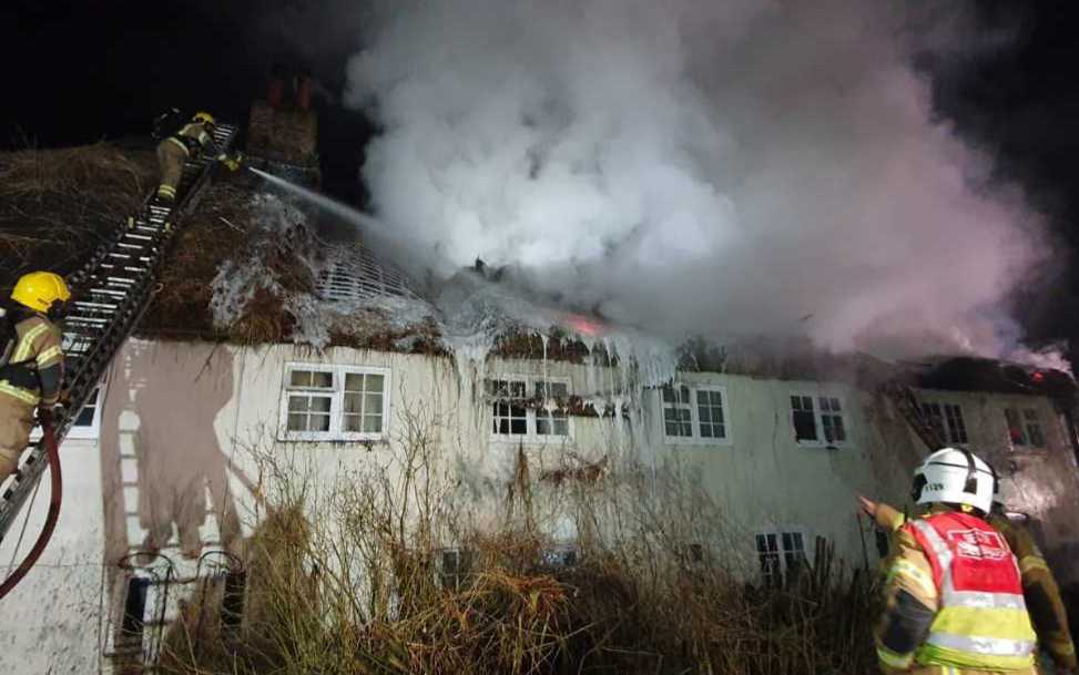 More than 100 firefighters tackle large fire at thatched cottages ...
