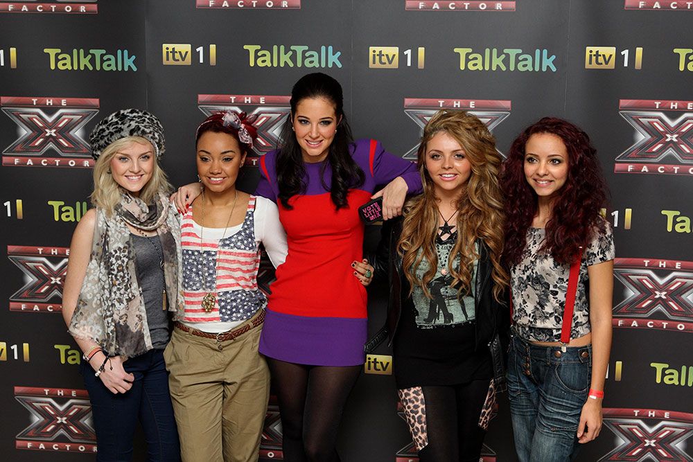 Perrie Edwards (left), Leigh-Anne Pinnock (second left), Jesy Nelson (second right)and Jade Thirlwall (right) of girl band Little Mix pose with their mentor Tulisa Contostavlos (centre) 