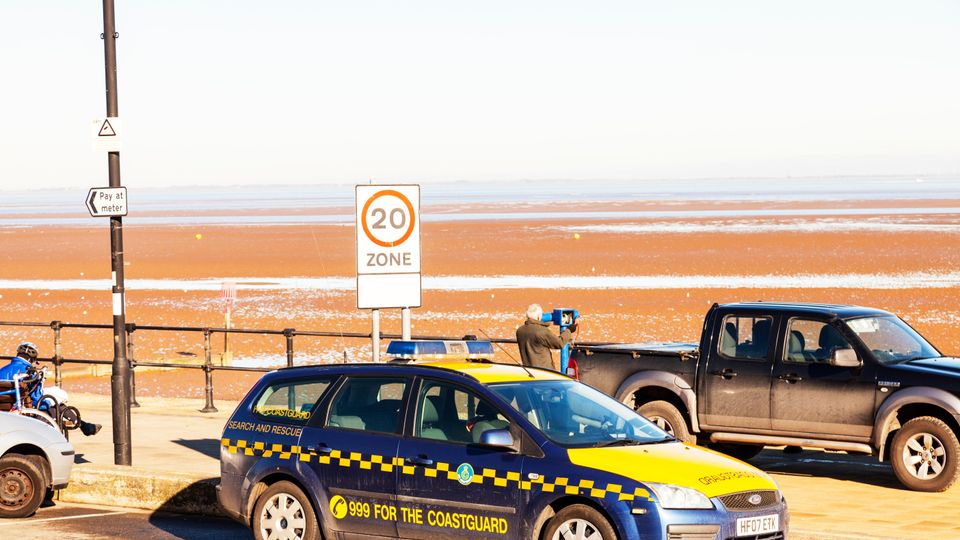 Coastguard car vehicle parked waiting 999 call Cleethorpes town coast beach front lincolnshire