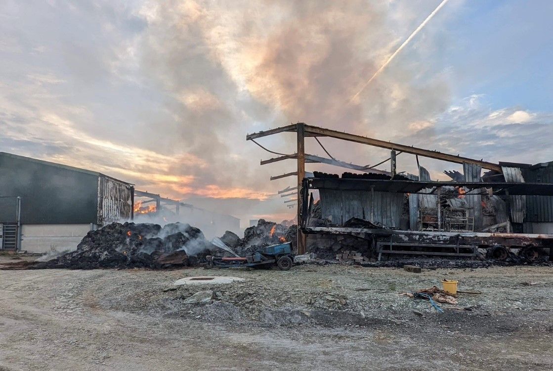 Massive barn fire seen from A30 burns for SECOND night