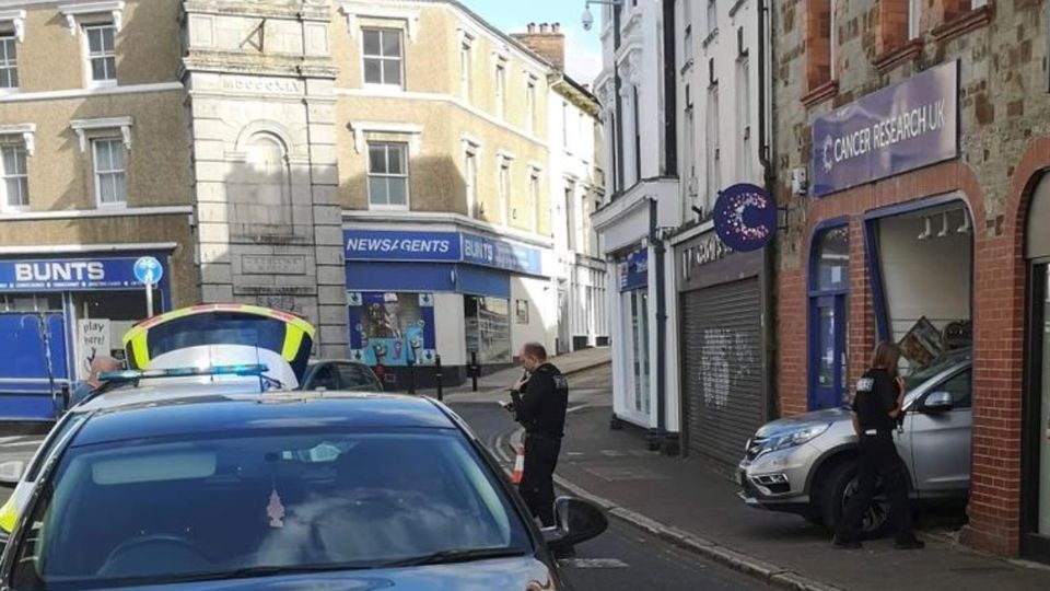 Police at scene of charity shop car crash in Bodmin