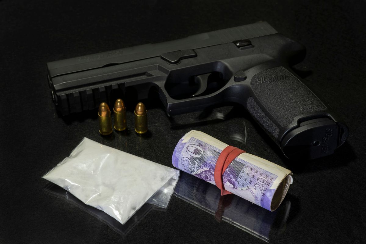 Man charged after drugs and firearms seized in Lanarkshire