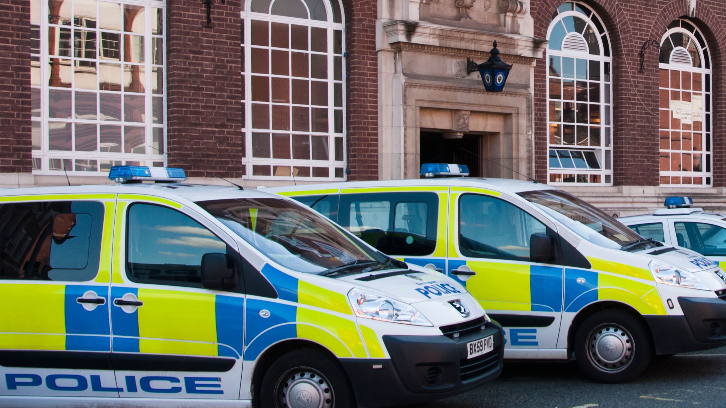 West Midlands Police vans and cars