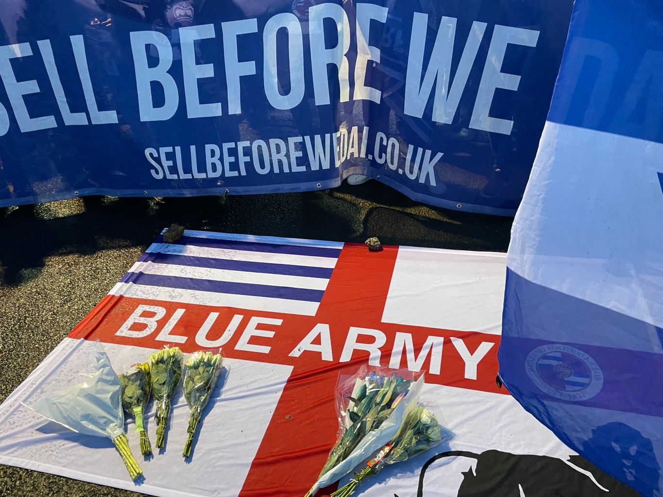 Flowers, flags and banners led down in opposition to the potential sale of Reading FC's training grounds