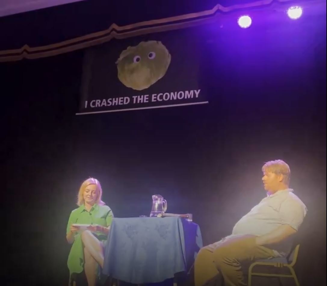 Liz Truss walks off stage after 'I crashed the economy' lettuce banner ...