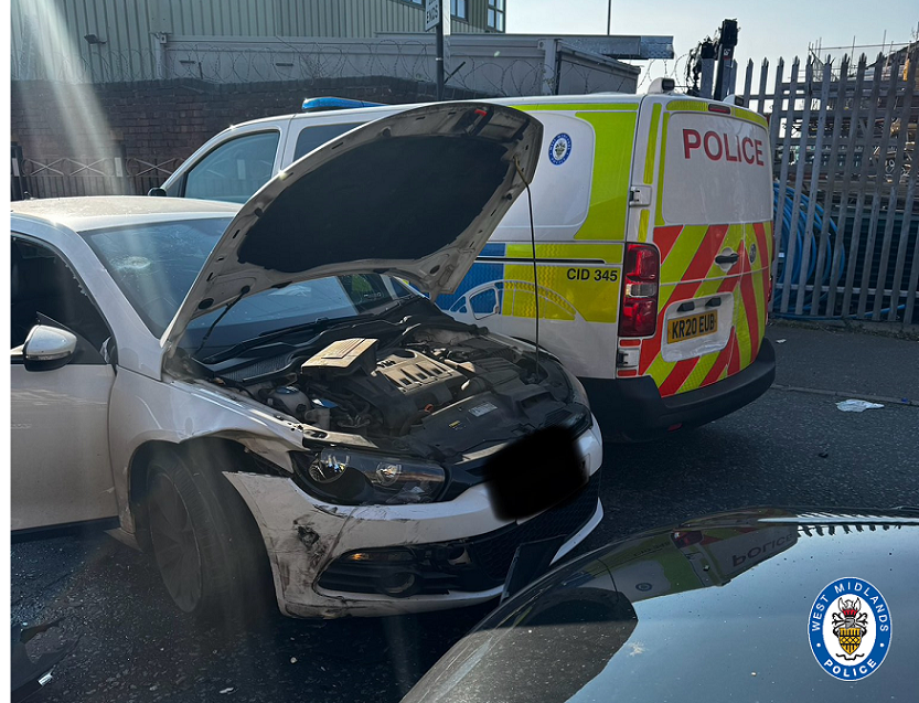 Man arrested after police cars rammed and officers injured in ...