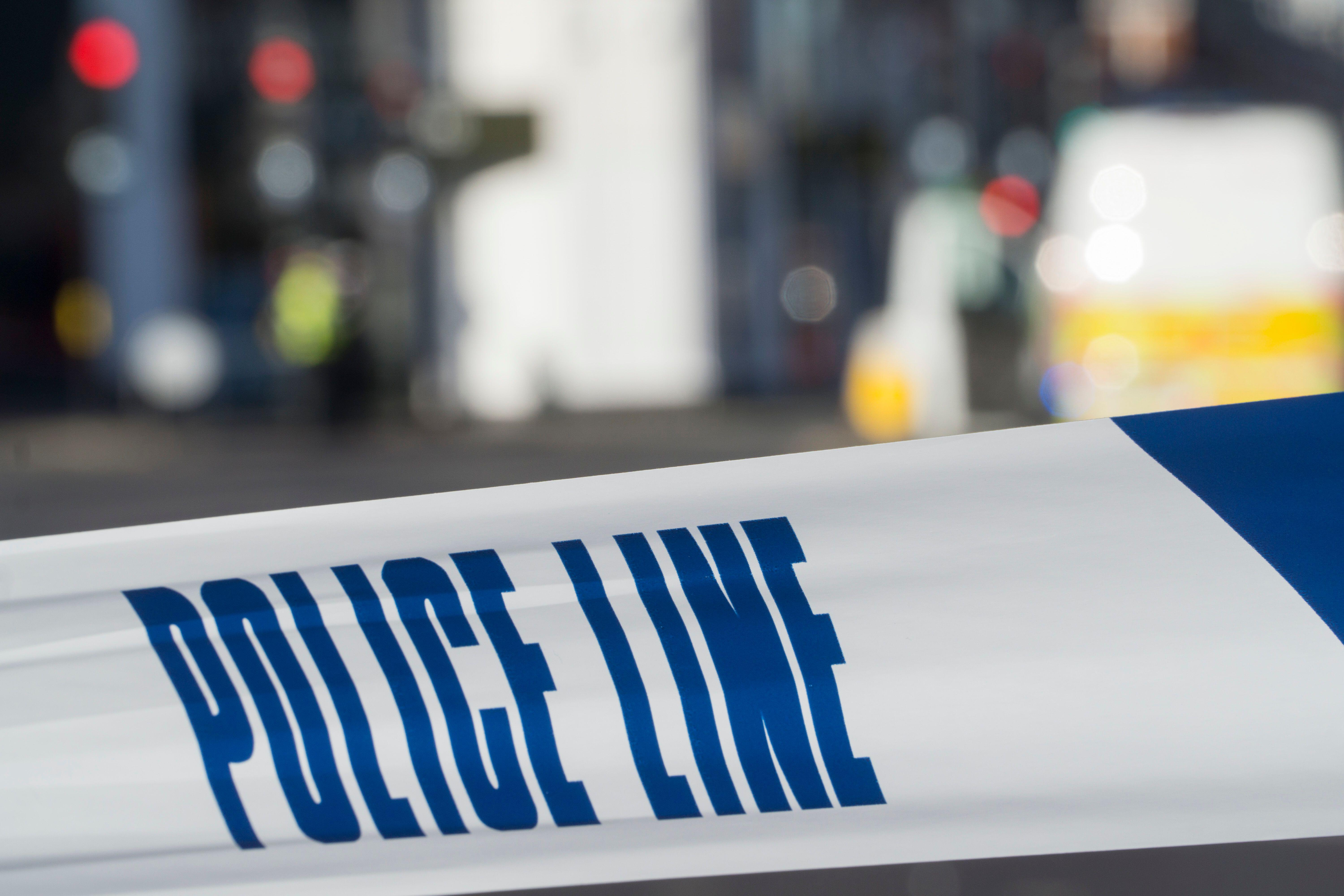 Woman dies and man left critical in triple shooting in north London