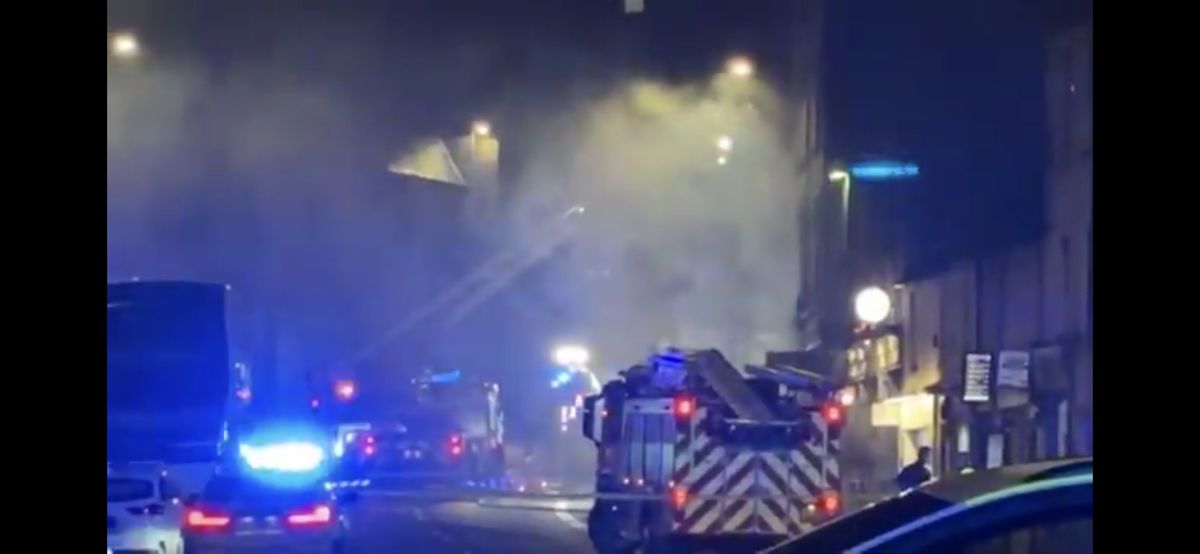 An Edinburgh street was evacuated as fire crews battled a shop blaze