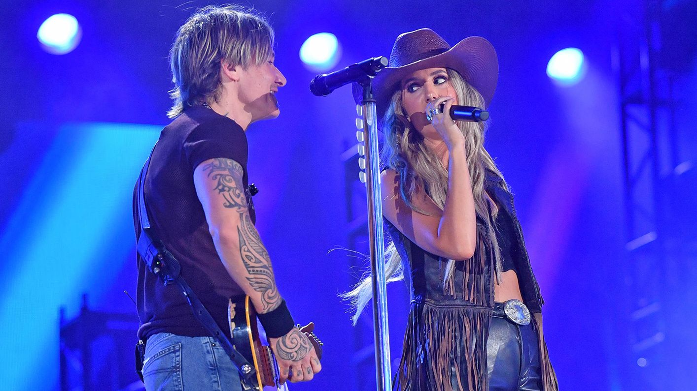 Keith Urban and Lainey Wilson performing live on stage