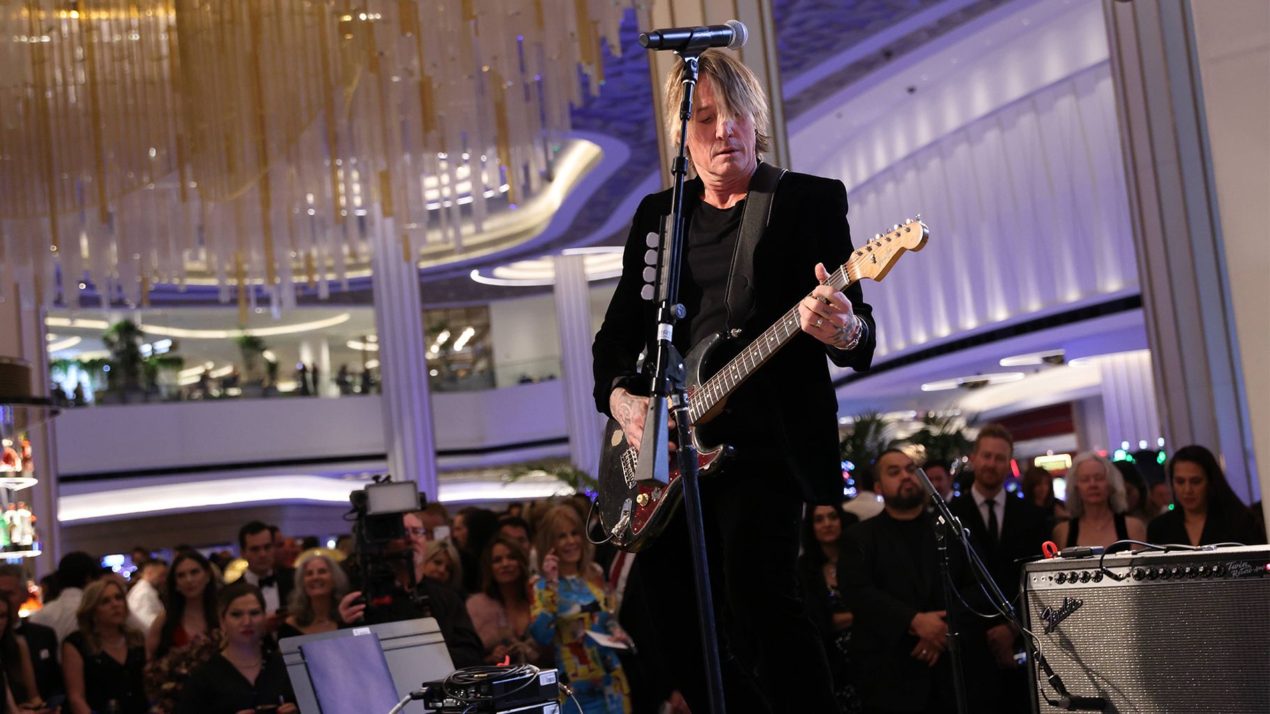 Keith Urban playing the guitar while performing live on stage at the Fontainebleau in Las Vegas
