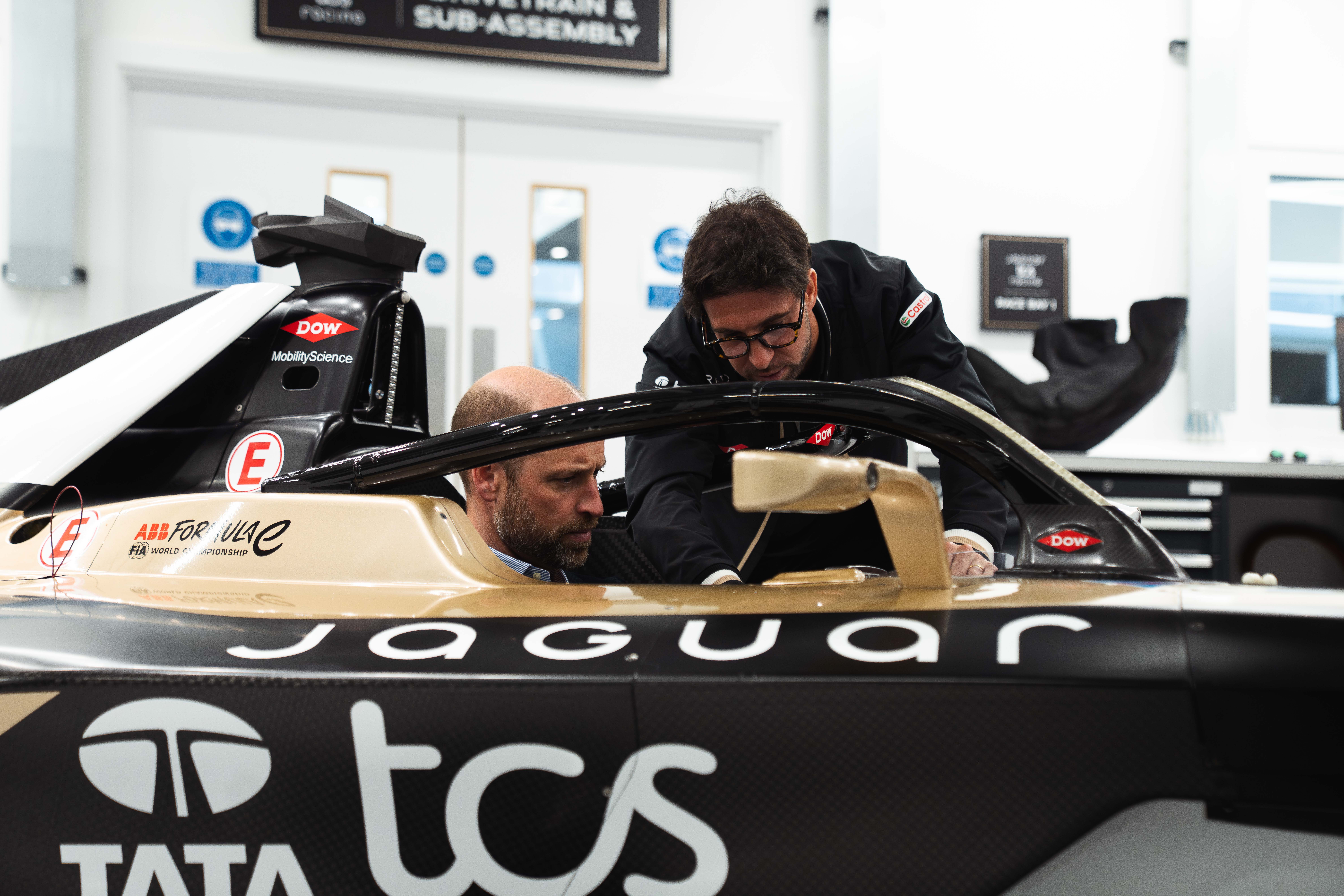 Prince William squeezes into replica race car and jokes about Ai ...