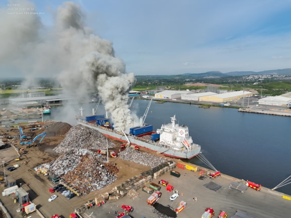 Fire crews tackle blaze on board ship at Newport Docks