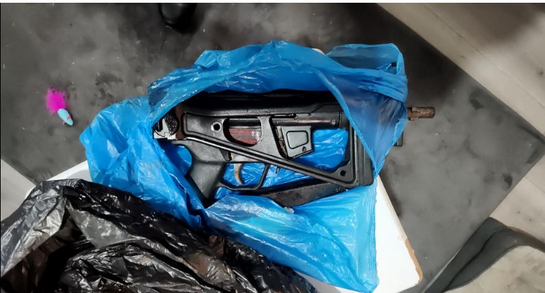 Sub-machine gun and pistol found in Stockport
