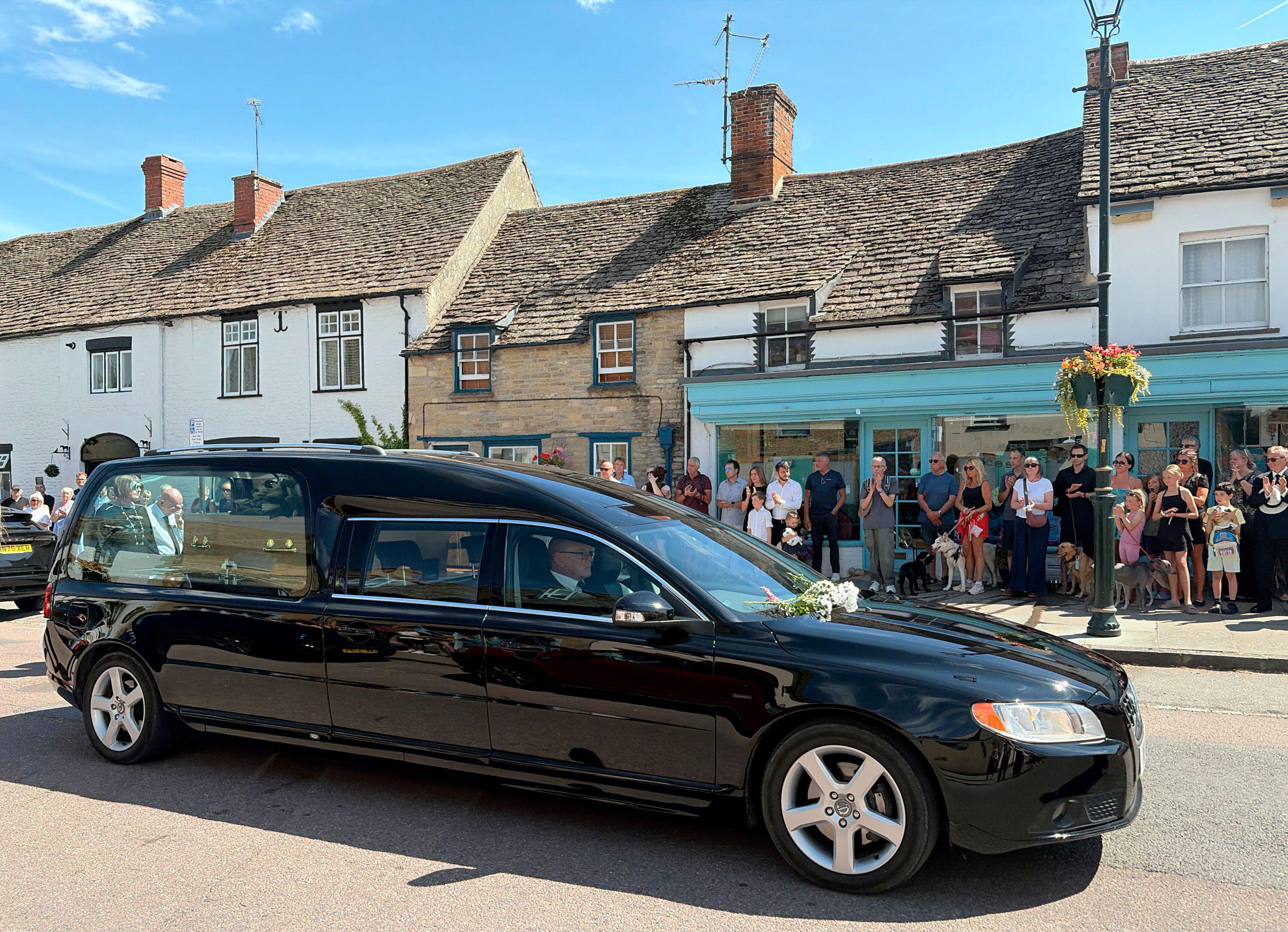 Hundreds line high street to pay respects to much-loved pet shop owner