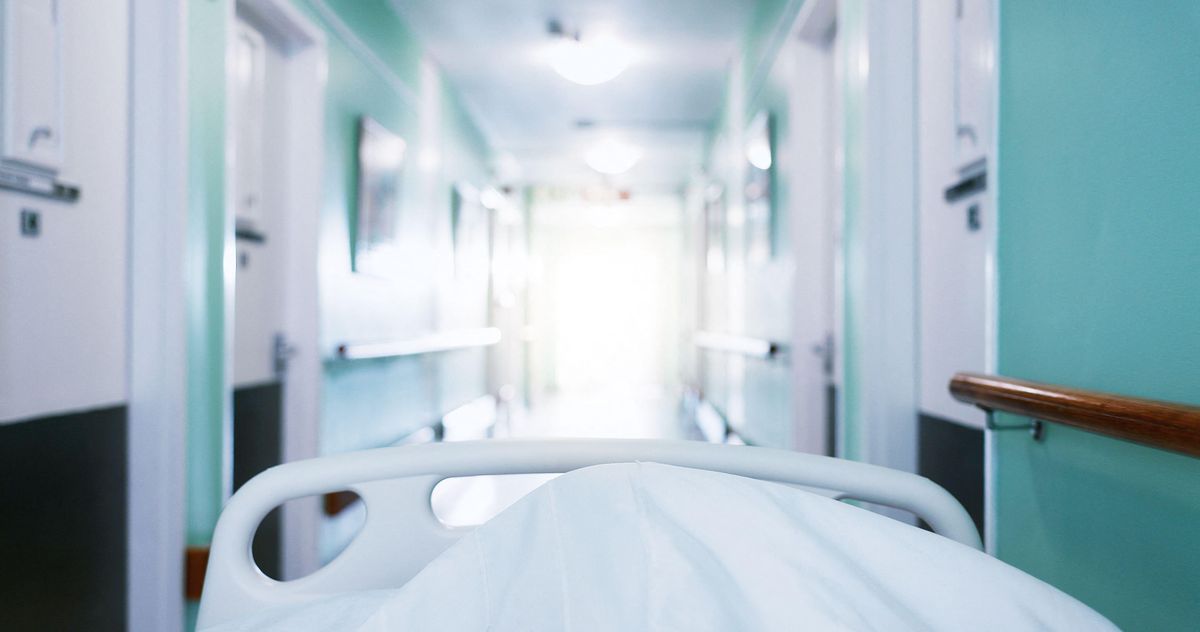 Nurses giving end-of-life care in corridors